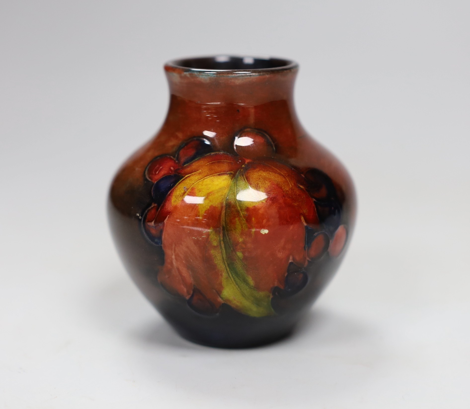 A Moorcroft flambé leaf and berry vase, 8cm